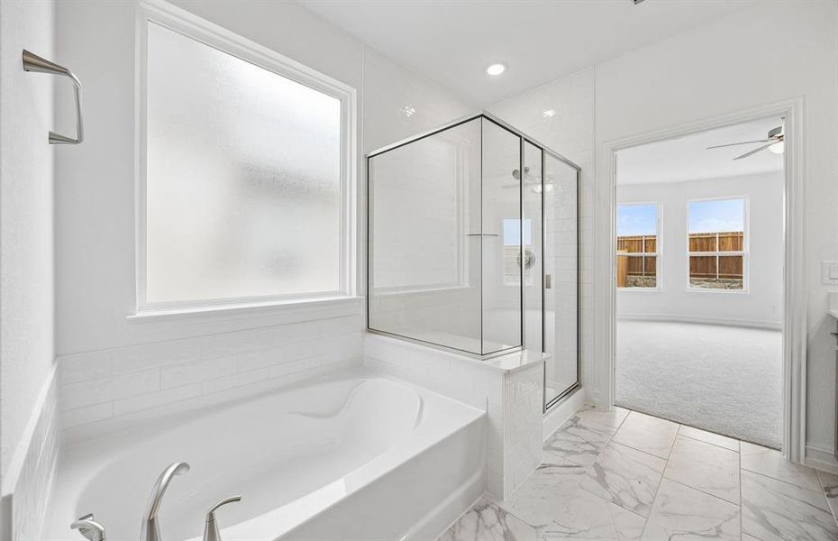 Separate tub and shower in primary suite Separate tub and shower in primary suite
