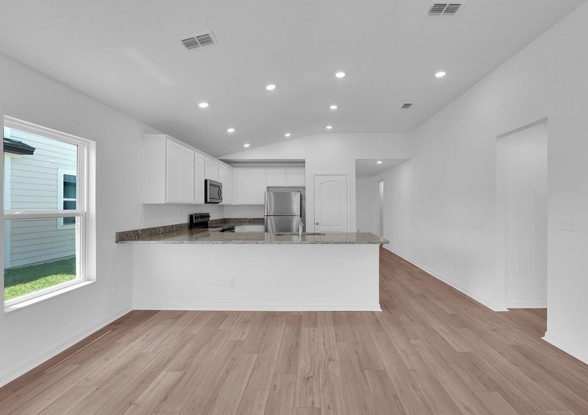 Move freely between the family room and kitchen Move freely between the family room and kitchen