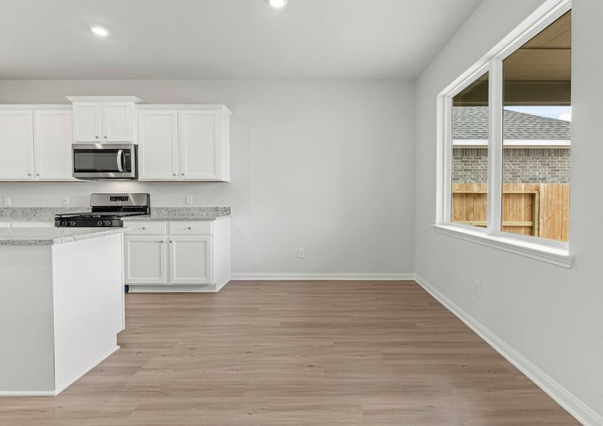 Dining room with a window overlooking the backyard Dining room with a window overlooking the backyard
