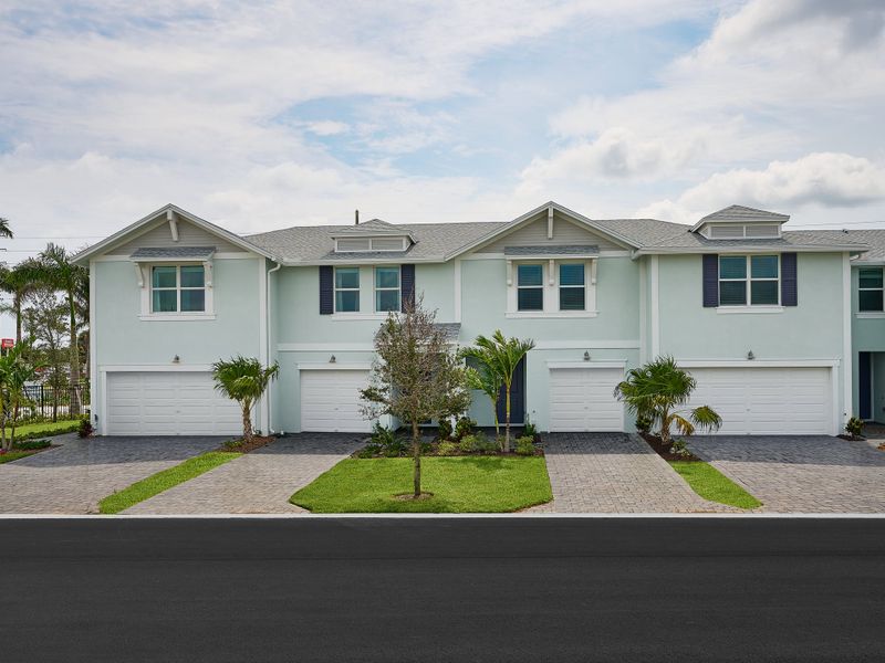 Front exterior of a new home in Tidewater, Fort Pierce, FL, highlighting curb appeal (Image 1).