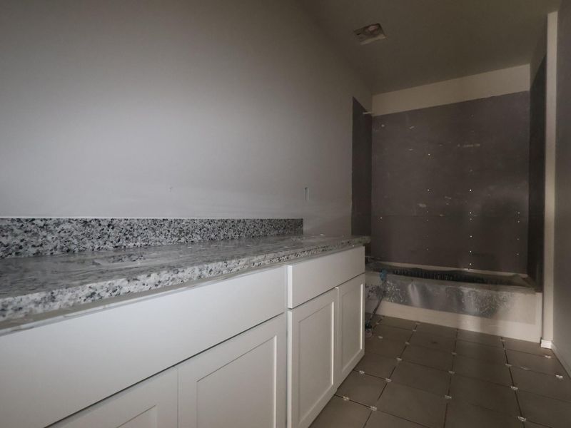 In-progress construction of a new home in Carillon, Manor, TX (Image 21).