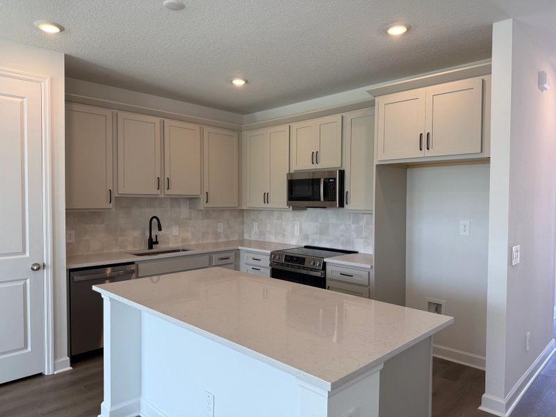 Sophisticated kitchen features a large island and ample cabinetry, ideal for any home chef