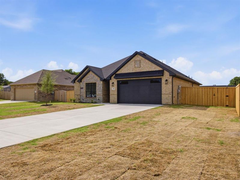 Front exterior of a new home in , Grand Prairie, TX, highlighting curb appeal (Image 15).