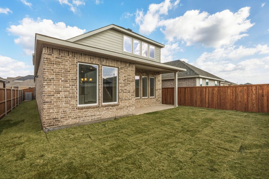 Exterior details and patio area of a home in Walden Pond, Forney (Image 20).