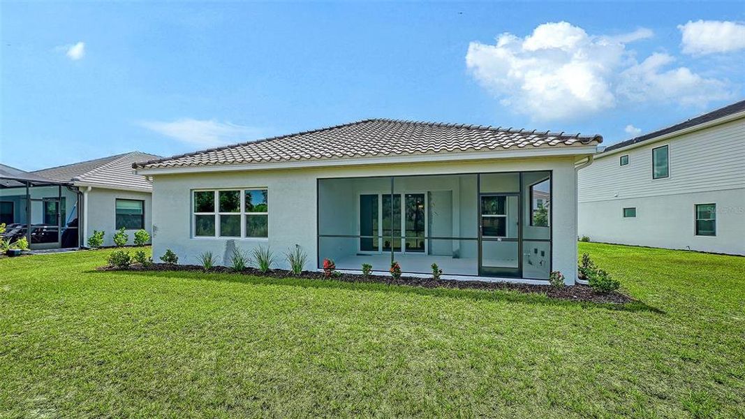 Exterior details and patio area of a home in Grand Park, Sarasota (Image 24).