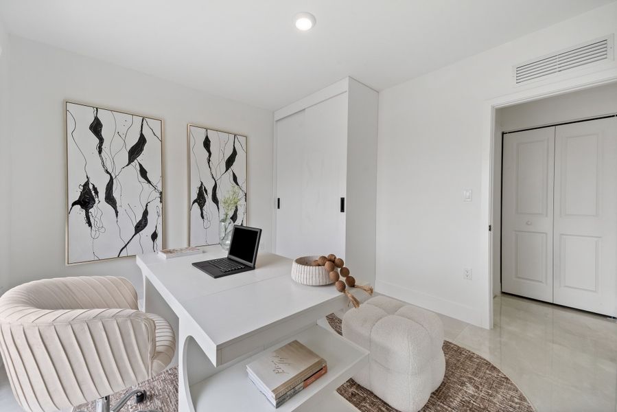 Representative furnished interior of a home built from the Model E by Onx Homes in On Alba, Florida City (Image 41).