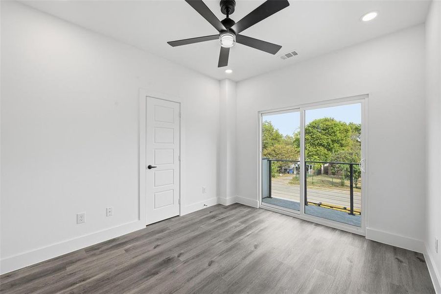 Empty room featuring wood finished floors, recessed lighting, and ceiling fan