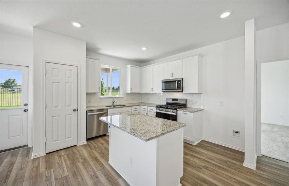 Airy kitchen with ample cabinet space *real home pictured