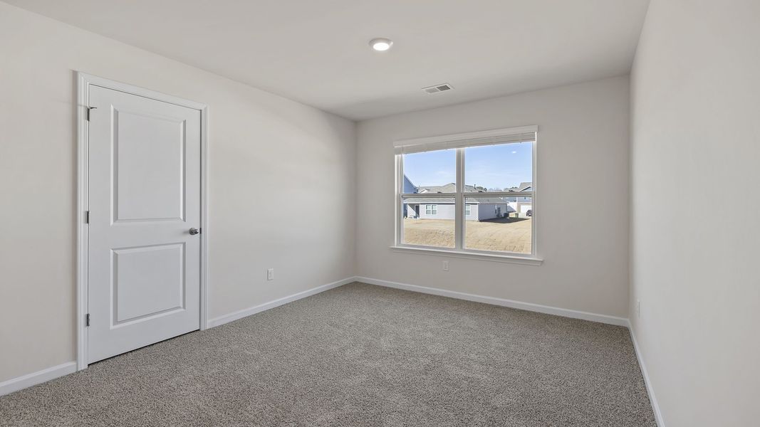 Spacious, unfurnished interior of a new home in Bentley Park, Greenwood (Image 25).