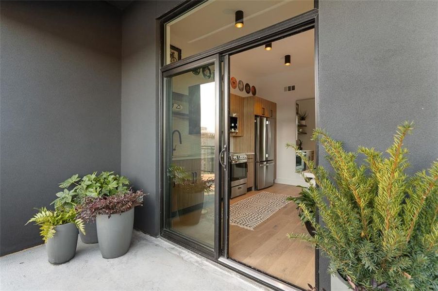 Exterior details and patio area of a home in The Leon on Ponce, Atlanta (Image 1).