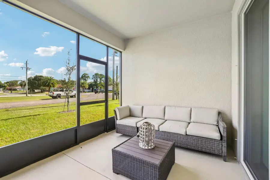 Exterior details and patio area of a home in Golden Gate, Naples (Image 4).
