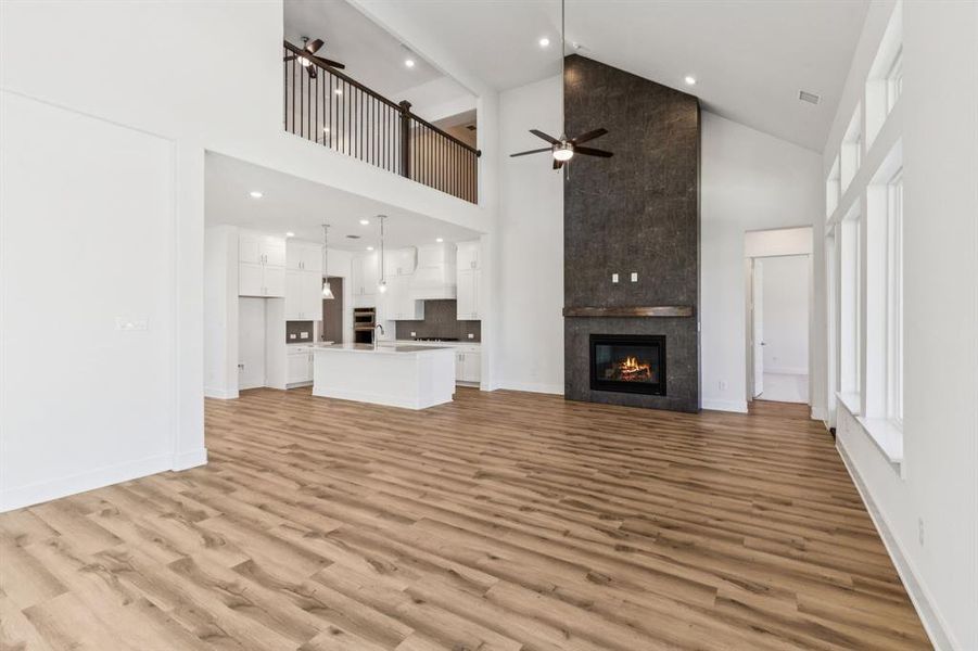 You'll enjoy hosing the entire family in this spacious family room featuring a striking fireplace!