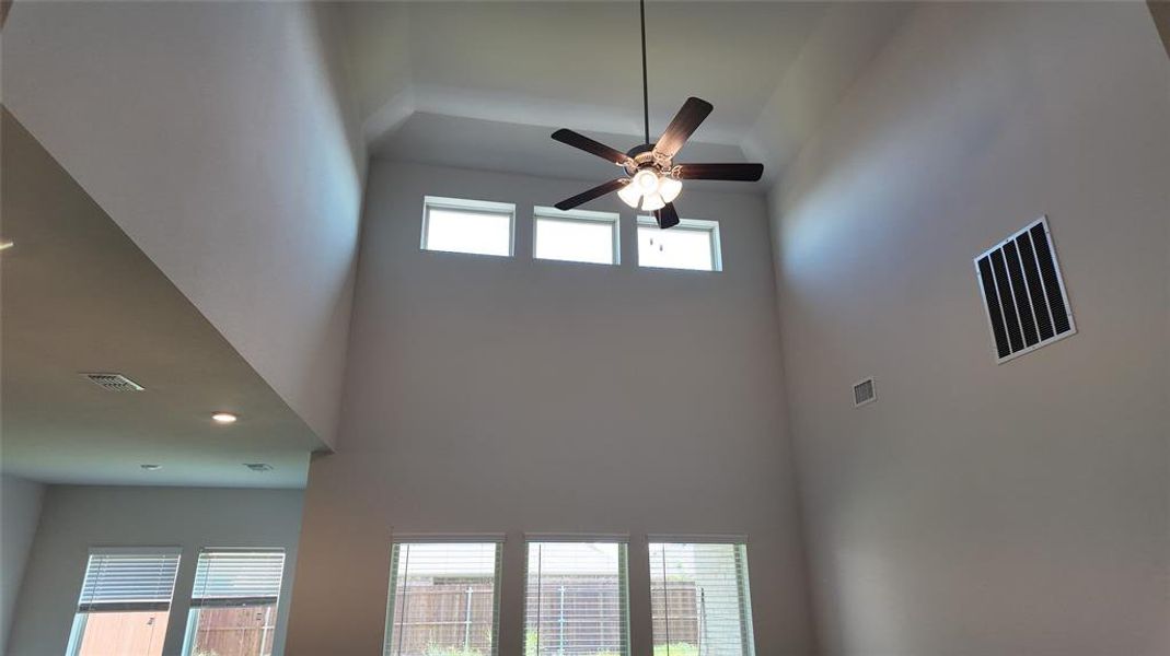 Detailed view of a ceiling fan and recessed lighting