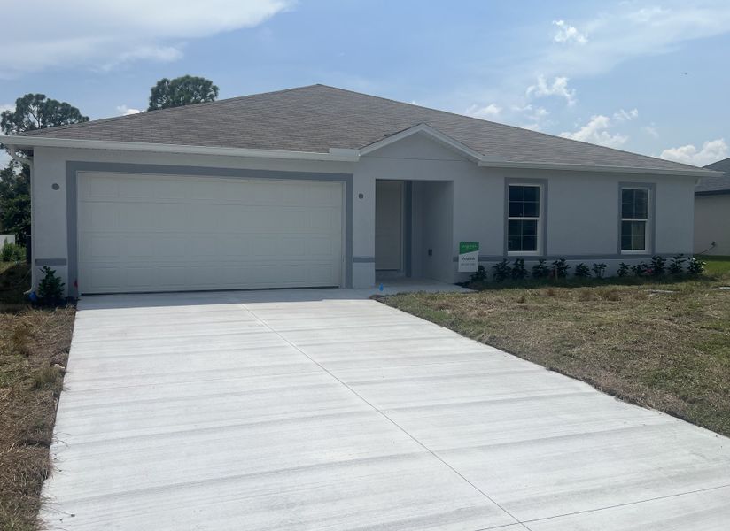 Front exterior of a new home in Lehigh Acres, Lehigh Acres, FL, highlighting curb appeal (Image 2). Front exterior of a new home in Lehigh Acres, Lehigh Acres, FL, highlighting curb appeal (Image 2).