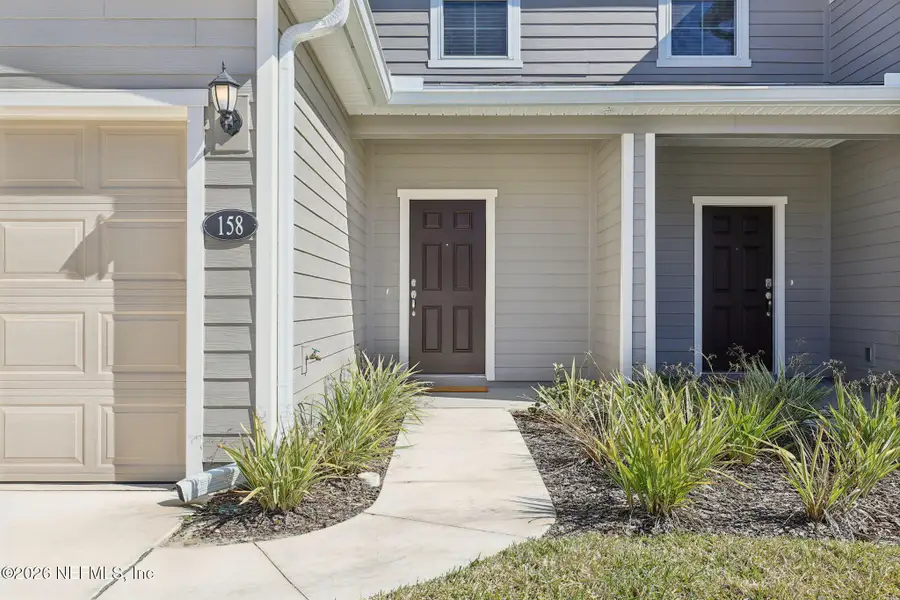 Exterior details and patio area of a home in Orchard Park Townhomes, St. Augustine (Image 2). Exterior details and patio area of a home in Orchard Park Townhomes, St. Augustine (Image 2).
