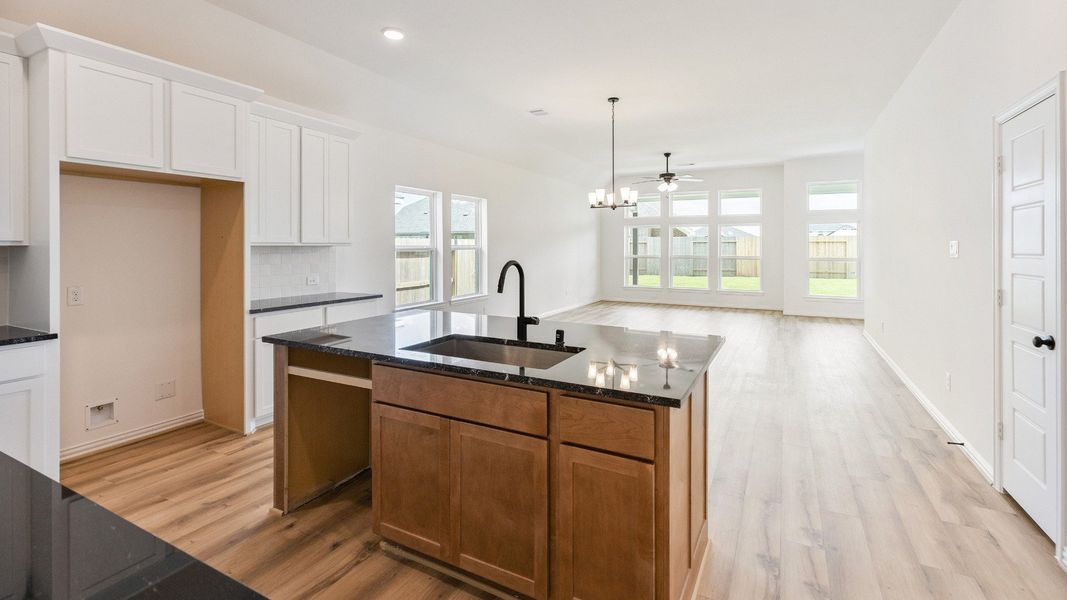 Furnished interior view inside a new home in Creekhaven, Iowa Colony (Image 13).