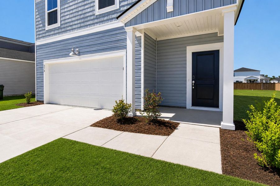 Exterior details and patio area of a home in Lindera Preserve at Cane Bay Plantation, Summerville (Image 19).