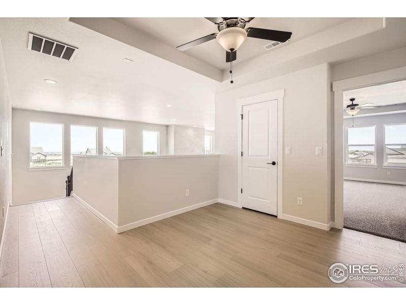 Spacious, unfurnished interior of a new home in RainDance National 60/70, Windsor (Image 28).