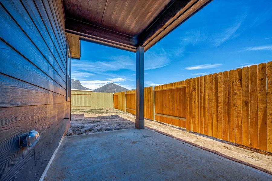 Exterior details and patio area of a home in Mill Creek Trails, Magnolia (Image 23).