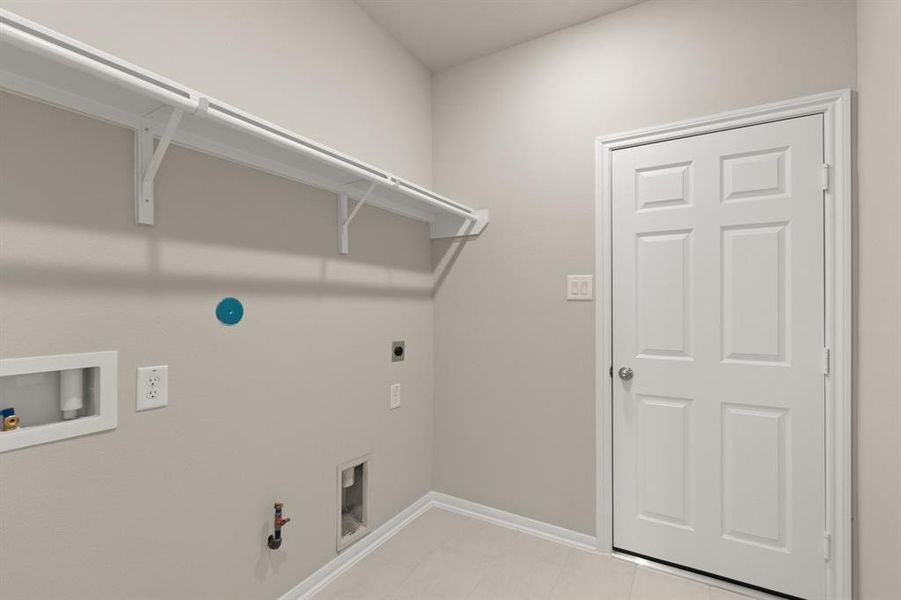 The laundry room layout is carefully planned for optimal workflow with designated areas for washing, drying, and storing.