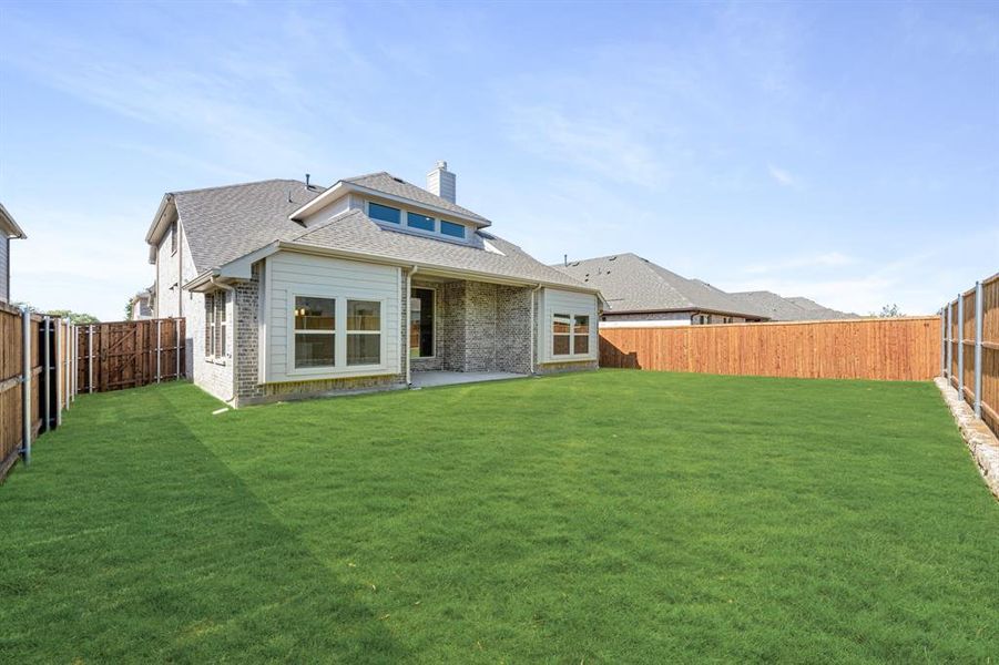 Front exterior of a new home in Woodstone, Providence Village, TX, highlighting curb appeal (Image 24). Front exterior of a new home in Woodstone, Providence Village, TX, highlighting curb appeal (Image 24).