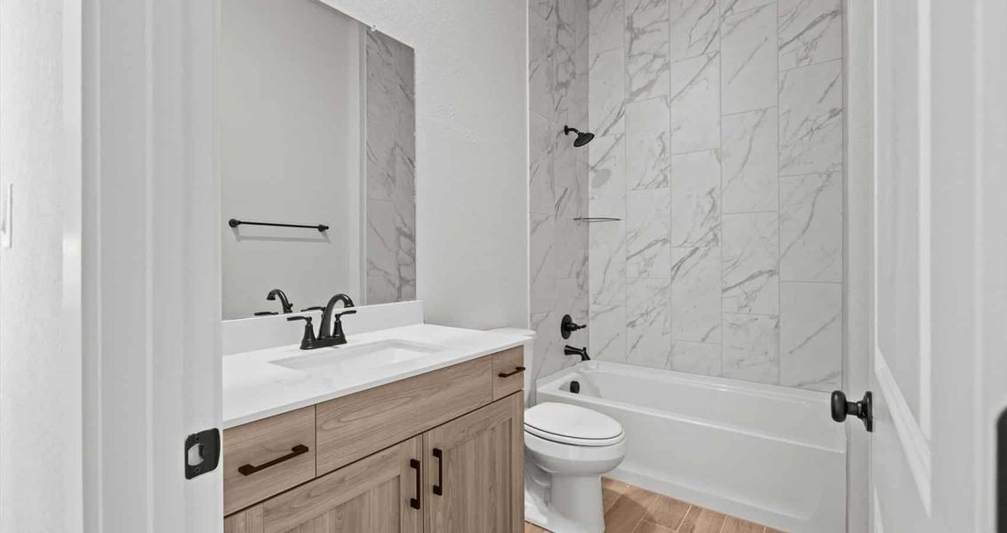 Representative furnished interior of a home built from the Marshall by Chesmar Homes in Village at Three Oaks, Seguin (Image 7).