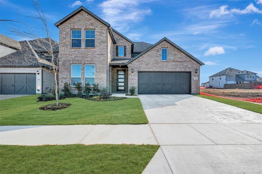 Front exterior of a new home in Lily Creek at Sutton Fields, Aubrey, TX, highlighting curb appeal (Image 1). Front exterior of a new home in Lily Creek at Sutton Fields, Aubrey, TX, highlighting curb appeal (Image 1).