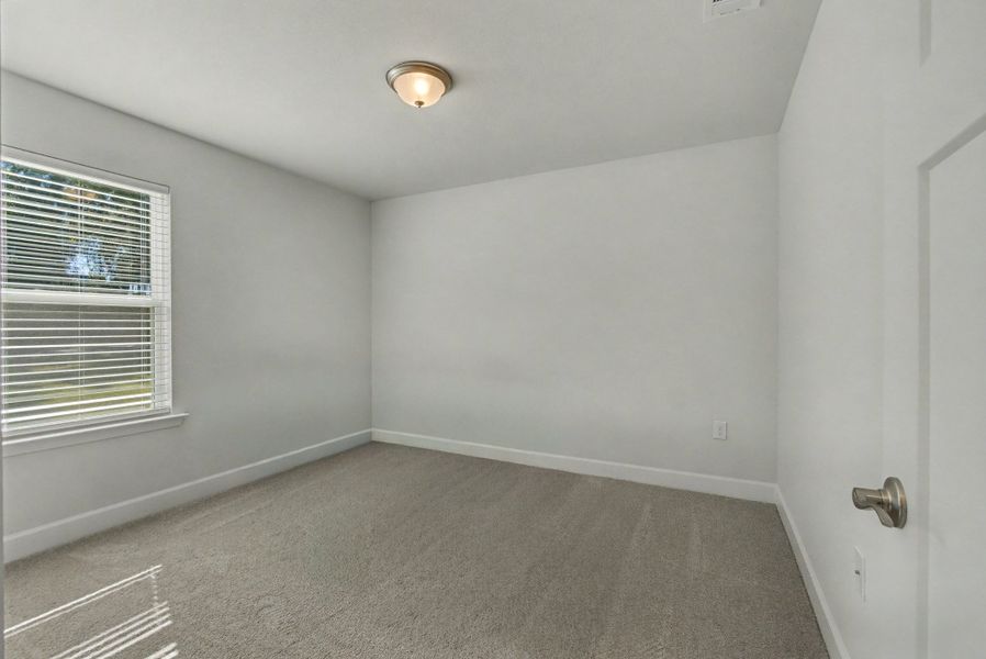 Representative unfurnished interior of a home built from the Plan 1250 by Adams Homes in Turtle Creek, Cantonment (Image 21).