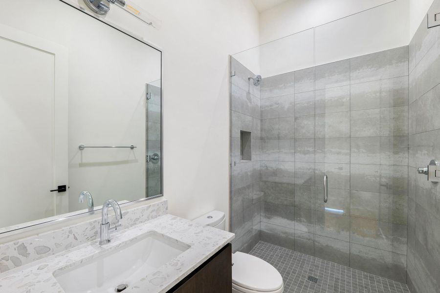Full bathroom with vanity and a walk in shower