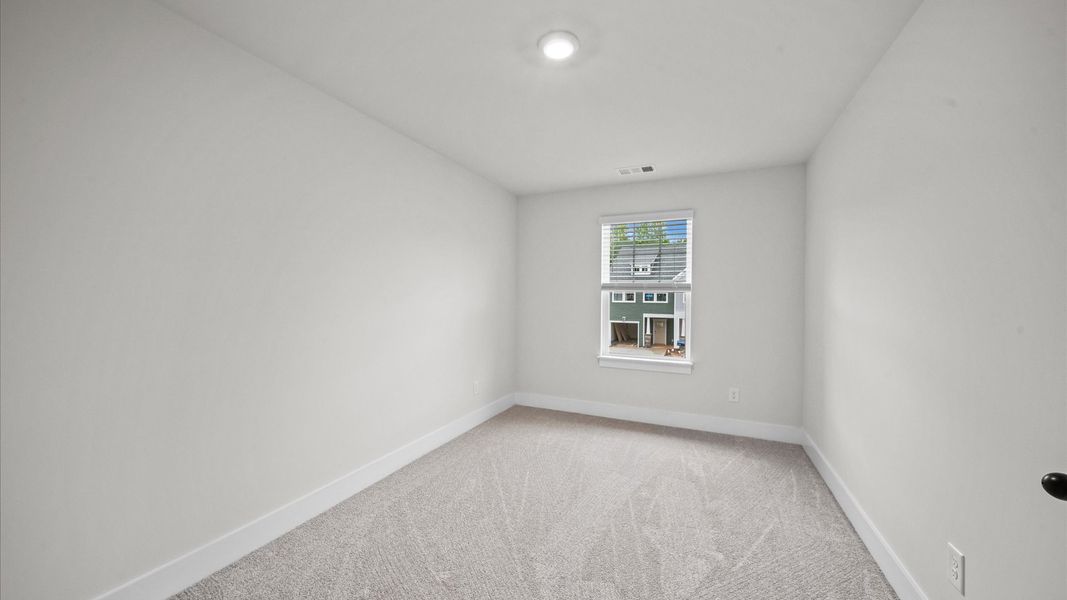 Bedroom with plush carpet in two story townhome at Ransdell Pointe by DRB Homes in Spartanburg, SC Bedroom with plush carpet in two story townhome at Ransdell Pointe by DRB Homes in Spartanburg, SC