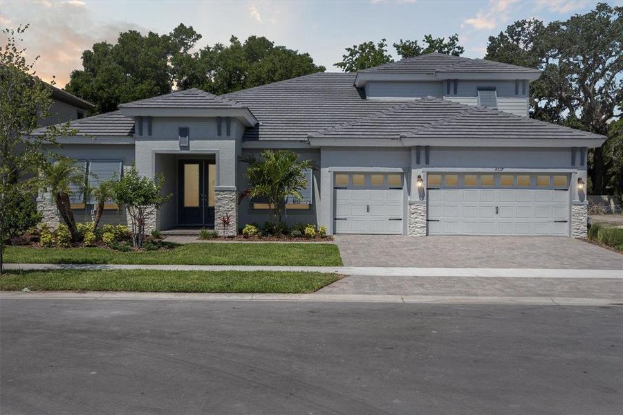Front exterior of a new home in Crestwood Estates, Valrico, FL, highlighting curb appeal (Image 25). Front exterior of a new home in Crestwood Estates, Valrico, FL, highlighting curb appeal (Image 25).