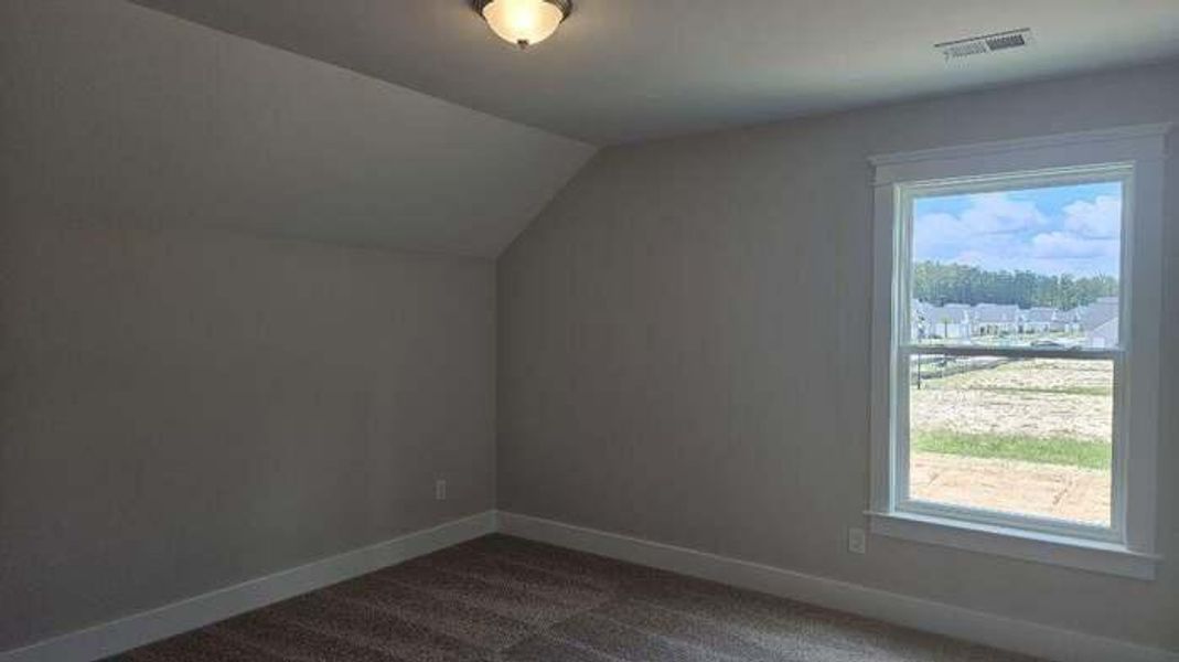 Spacious, unfurnished interior of a new home in The Enclave at French Quarter Creek, Huger (Image 15).