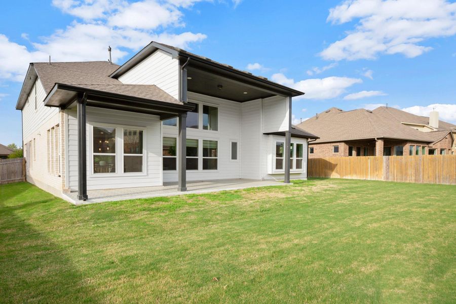 Outdoors, professional landscaping and automatic irrigation keep the yard looking sharp. Outdoors, professional landscaping and automatic irrigation keep the yard looking sharp.