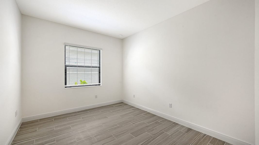 Spacious, unfurnished interior of a new home in Palm Grove Real Estate and Homes for Sale in Lakewood Ranch, FL - Neal Communities, Bradenton (Image 30).