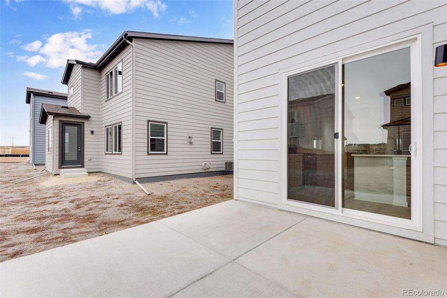 Exterior details and patio area of a home in Reunion, Commerce City (Image 23).