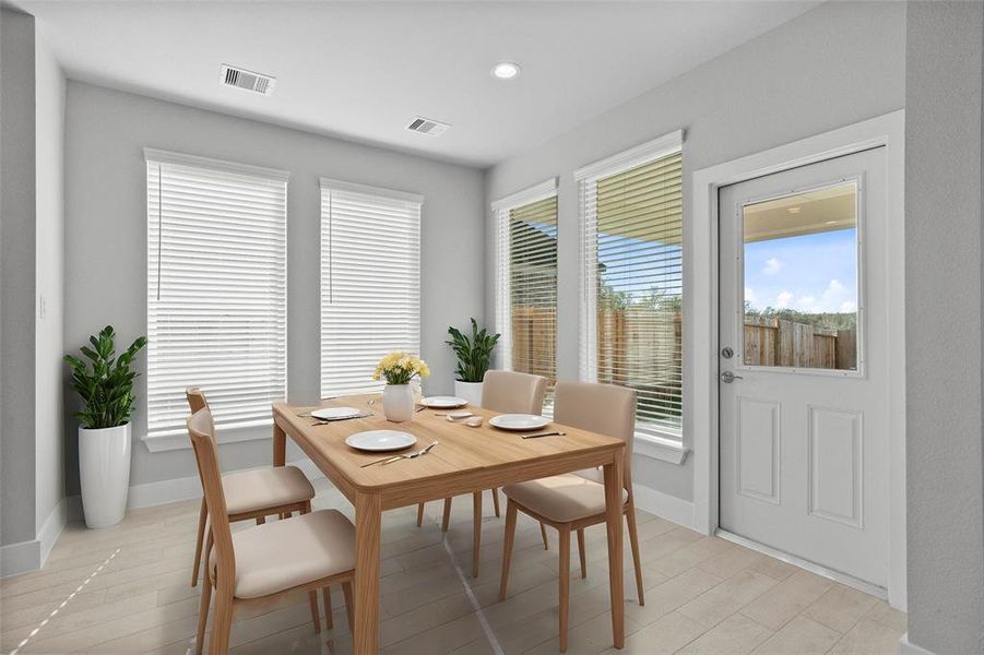 Make memories gathered around the table with your family and friends! This dining room features high ceilings, recessed lighting, large windows, and beautiful tile flooring!