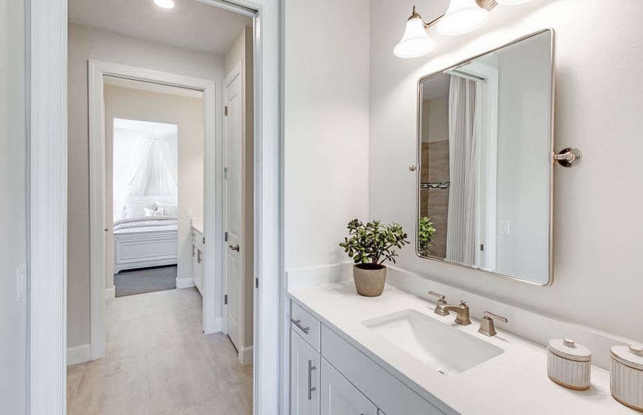Additional view of Jack and Jill style bathroom with private sinks