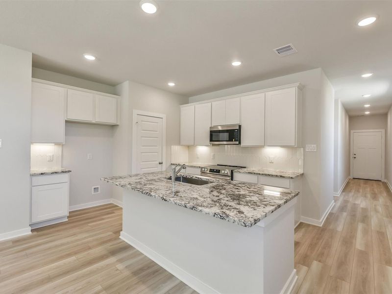Furnished interior view inside a new home in Spring Branch Crossing, Conroe (Image 13).
