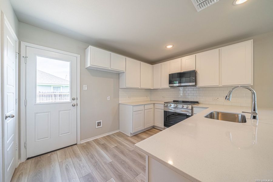 Furnished interior view inside a new home in , Seguin (Image 7).