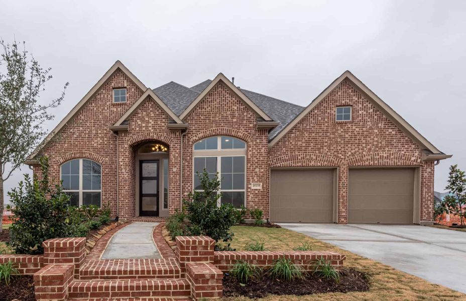 Representative exterior photo of a completed home built from the 3030 by Ravenna Homes in The Woodlands Hills 65′, Willis, TX (Image 20). Representative exterior photo of a completed home built from the 3030 by Ravenna Homes in The Woodlands Hills 65′, Willis, TX (Image 20).
