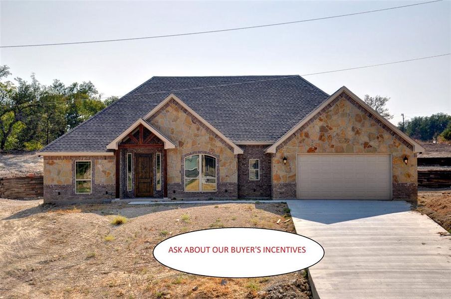 View of front of property with a garage