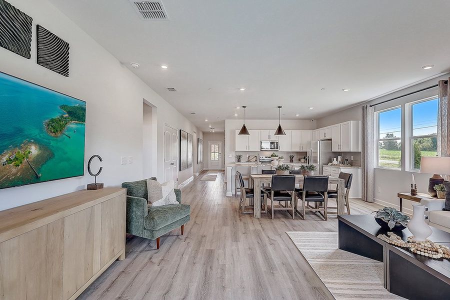 A large kitchen with a dining room.