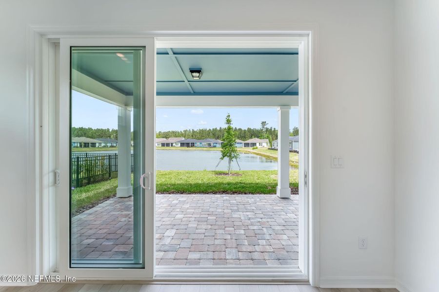 Exterior details and patio area of a home in Del Webb Wildlight, Wildlight (Image 26).