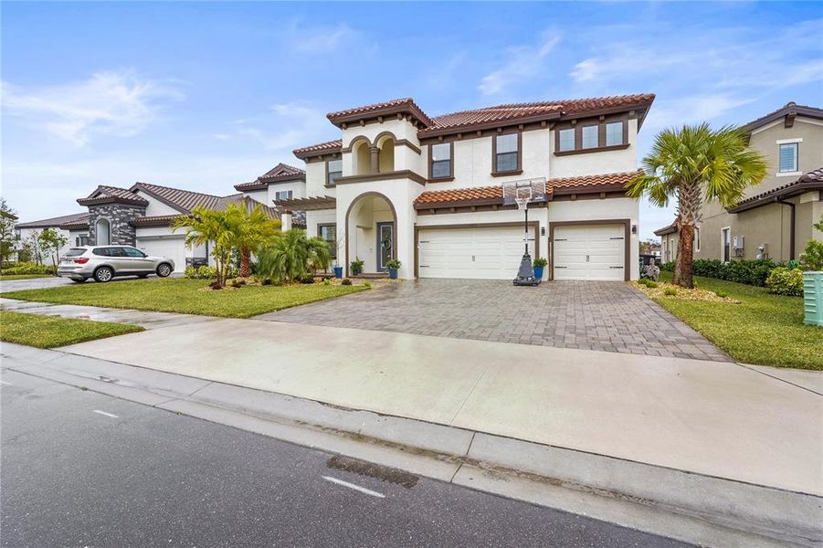 Front exterior of a new home in , Parrish, FL, highlighting curb appeal (Image 20).