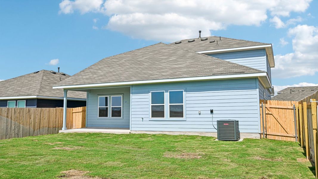 Exterior details and patio area of a home in Carillon, Manor (Image 25).