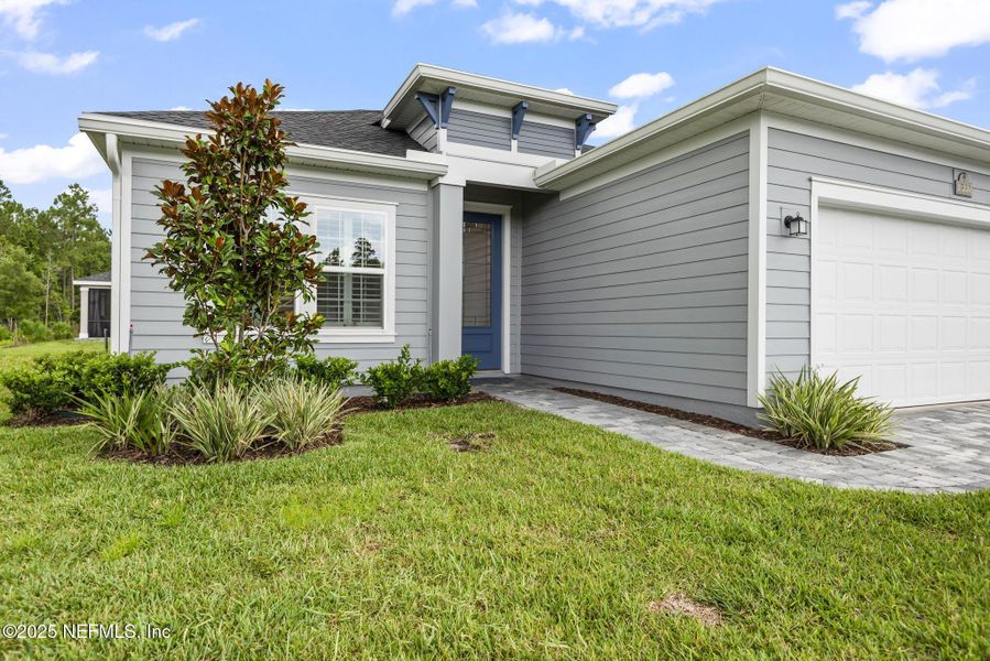 Front exterior of a new home in Stillwater | Active Adult 55+: Stillwater (50s) - Royal Collection, St. Johns, FL, highlighting curb appeal (Image 26). Front exterior of a new home in Stillwater | Active Adult 55+: Stillwater (50s) - Royal Collection, St. Johns, FL, highlighting curb appeal (Image 26).
