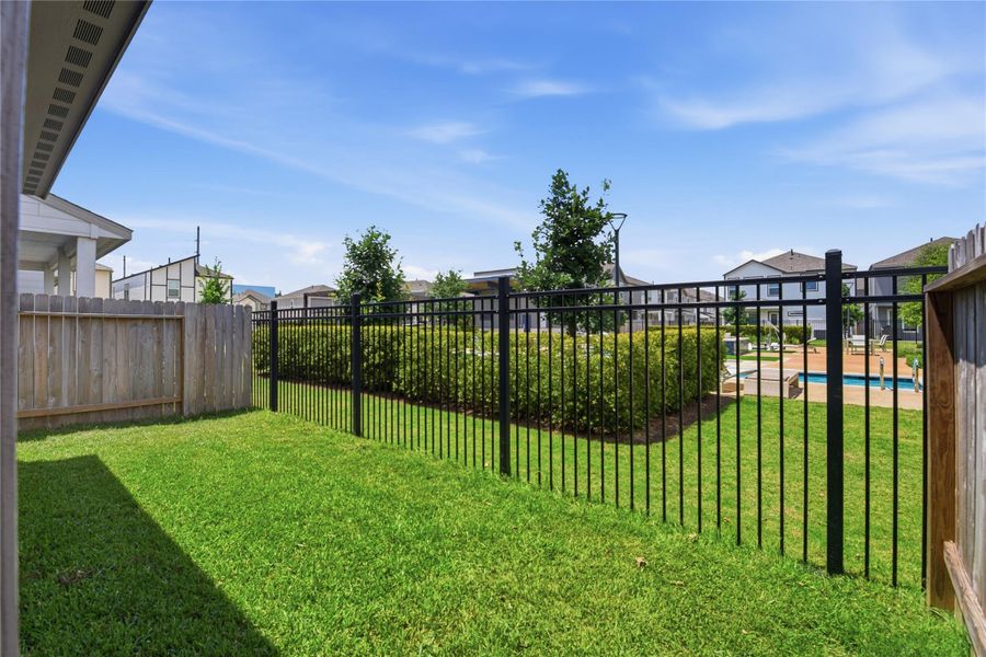 Exterior details and patio area of a home in Dunvale Village - Townhome Collection, Houston (Image 24).