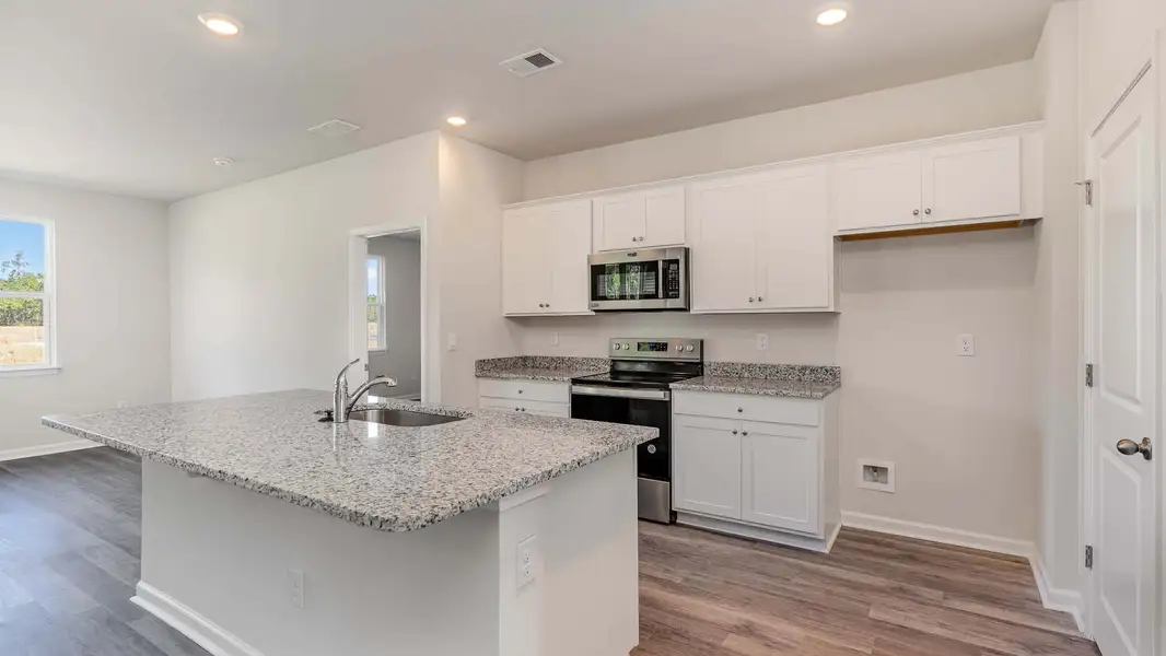 Representative furnished interior of a home built from the ARIA by D.R. Horton in Sandridge Park, Little River (Image 5).