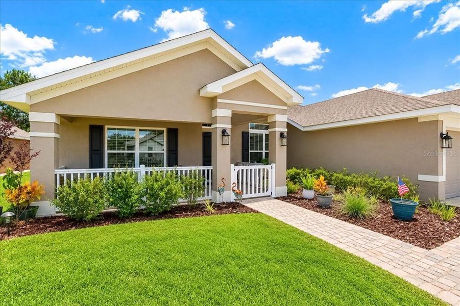 Front exterior of a new home in Juliette Falls, Dunnellon, FL, highlighting curb appeal (Image 24). Front exterior of a new home in Juliette Falls, Dunnellon, FL, highlighting curb appeal (Image 24).