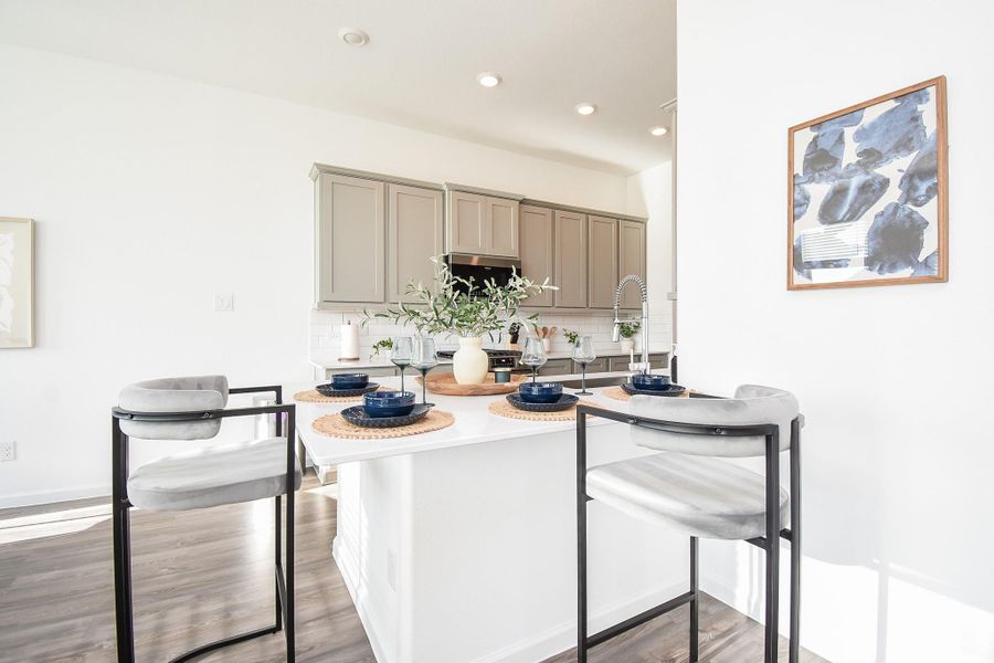 A functional kitchen with a breakfast bar, perfect for casual dining or entertaining.